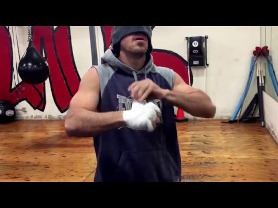 Coach Brandon Krause wrapping hands without watching