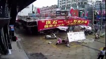 RAW  Scaffolding holding up a market stall in China dramatically collapses