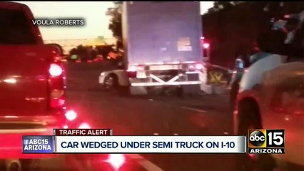 BREAKING: Car wedged under semi-truck on I-10