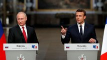 Macron and Putin vow to work together despite disagreements