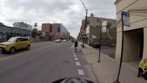 Motorcyclist turns right on red when we have right of way, cuts off cyclist in b