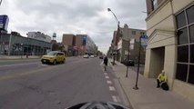 Motorcyclist turns right on red when we have right of way, cuts off cyclist in bike