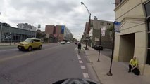 Motorcyclist turns right on red when we have right of way, cuts off cyclist in