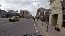 Motorcyclist turns right on red when we have right of way, cuts off cyclist in bike l