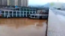 WATCH  Two Boats crash into a Bridge in China after being swept away by flood