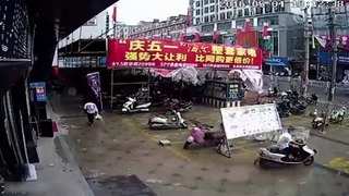 RAW  Scaffolding holding up a market stall in China dramatically c