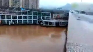 WATCH  Two Boats crash into a Bridge in China after being swept away by floo