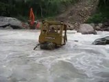 Dozer attempts river