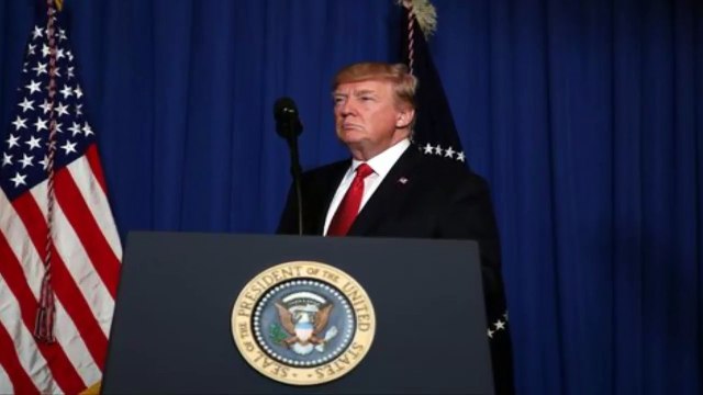 US President Donald Trump arrives to deliver a statement about missile strikes on a Syrian airfiel
