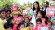 Poonam Pandey Distributes Raincoat To Poor and Needy Kids