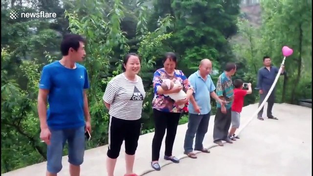 Kung fu master inflates balloons through extinguishing pipe