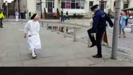 Nun shows off football skills in keepy uppy with policeman