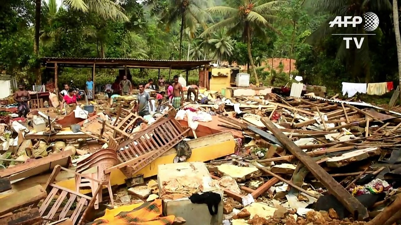 Chinese rescue workers help in clean-up after S...