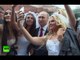 Putin selfies with models dressed as brides on Red Square during Moscow b-day celebrations