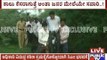 Zilla panchayath CEO carried by villagers to cross a muddy puddle in Raichur