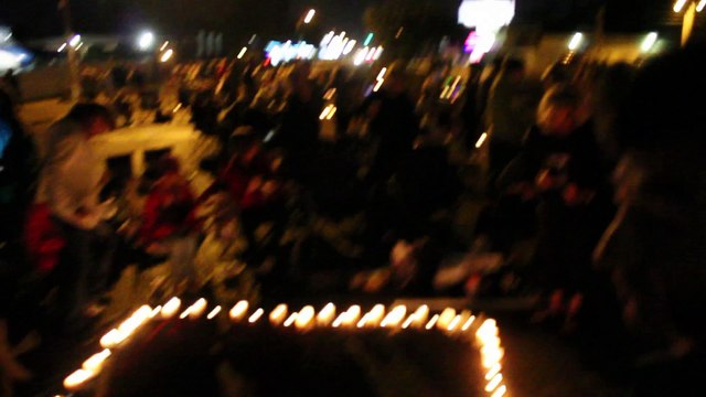 Chris Drummond painting on Elvis Presley Boulevard Candlelight Vigil Aug 15 2013