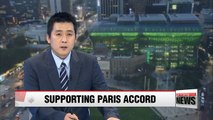 Seoul City Hall lights up in green showing support for Paris accord