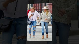 Hilary Duff rocks geek chic glasses while having a laugh with a friend after brunch in New York City