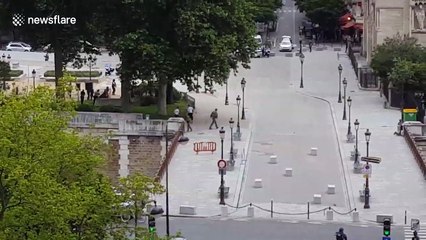 People running in front of Notre-Dame cathedral in Paris