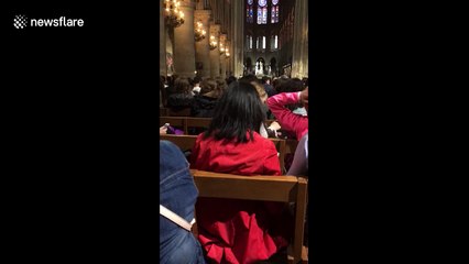 People wait inside Notre-Dame cathedral after 'attacker' reportedly shot by police