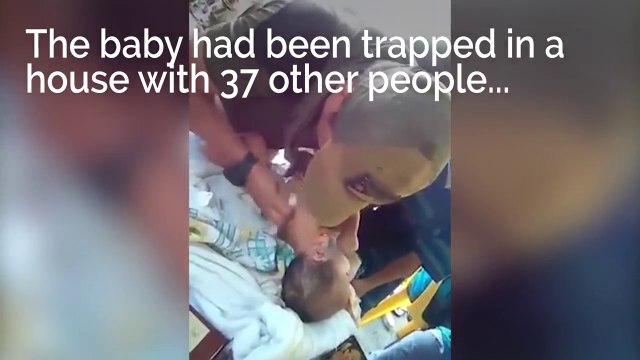 Soldiers tend to 2-month-old baby trapped in Philippines city of Marawi during clashes