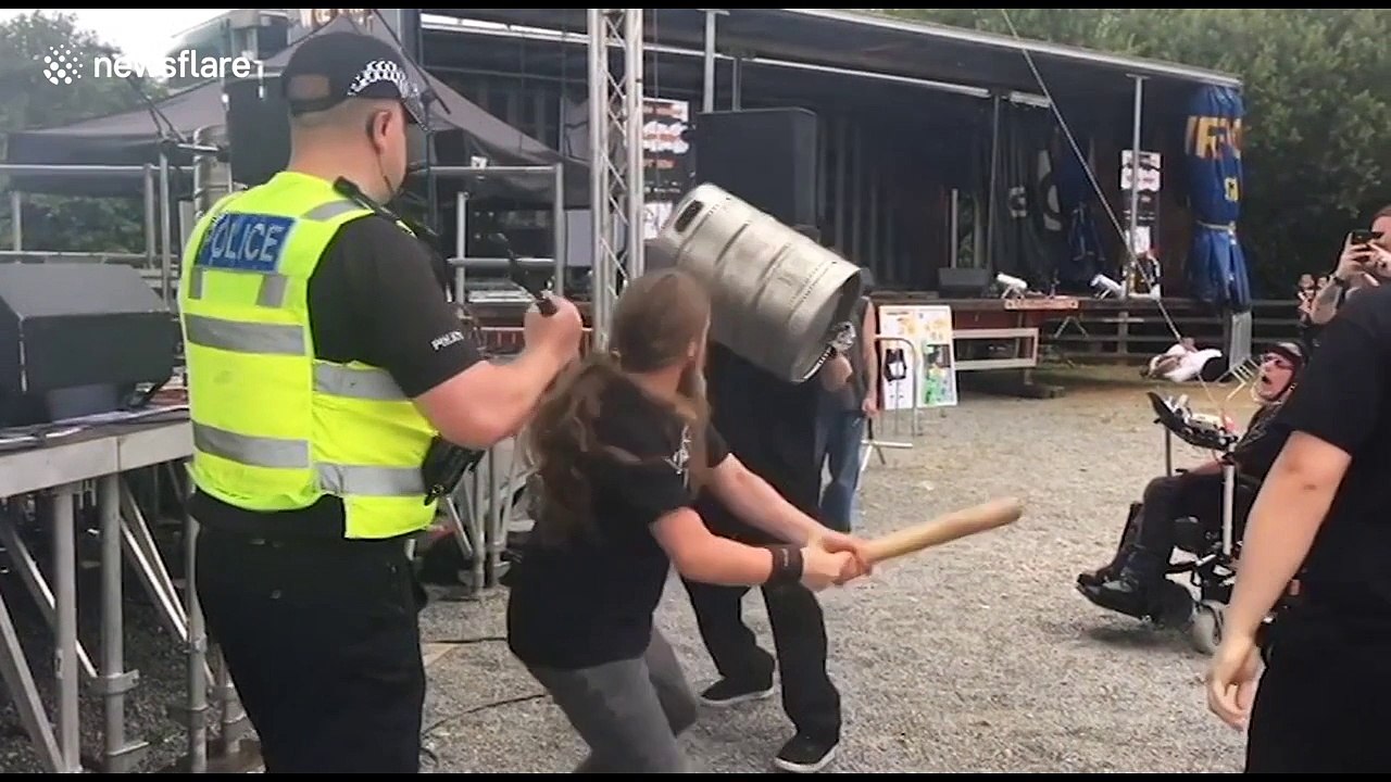 Now that's head-banging! Moshing UK metal fan whacks himself in head