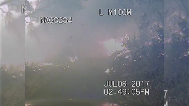 Dramatic footage shows police rescuing campers stranded by Whittier fire