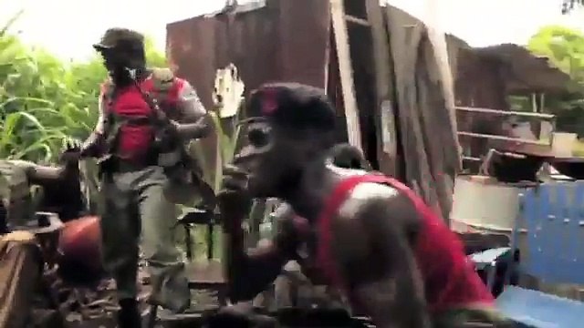 A monkey shooting an AK-47 in African jungle