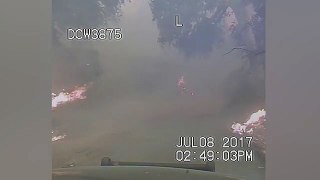 Terrifying footage shows cops driving from fire to save children _ Daily Mail Online