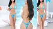 Bikini-clad Demi Rose Mawby flaunts her ample assets and peachy derriere as she slips into a tiny bikini in Ibiza