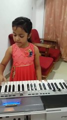 Girl singing and playing Piano