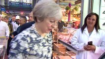 May booed on visit to London meat market
