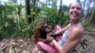Orangutan won't let got of woman in Indonesian jungle
