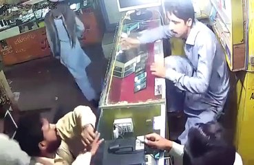CCTV footage of mobile shop being robbed