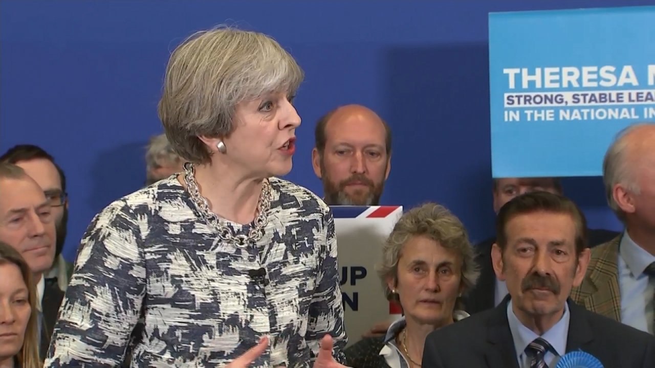 Theresa May pledges to change human rights laws...