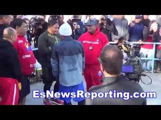 mayweather vs pacquiao manny checking out buboy's army hat - EsNews