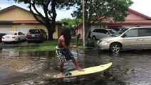 People 'Surf' Through Flooded South Florida Streets