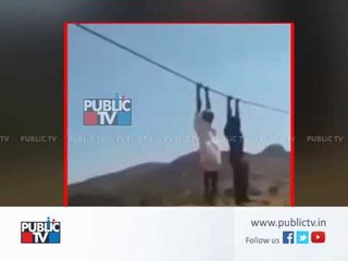 Farmers hold hightension electric wire in a way to protest for more compensation