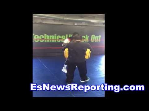 terence crawford on mitts gets ready for dulorme with coach Esau - EsNews