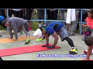 mayweather vs pacquiao manny having fun at camp swinging in palyground esnews boxing