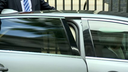 May exits 10 Downing Street and heads for Buckingham Palace