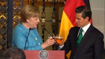 Angela Merkel pictured enjoying a drink as she urges May to get on with Brexit negotiations
