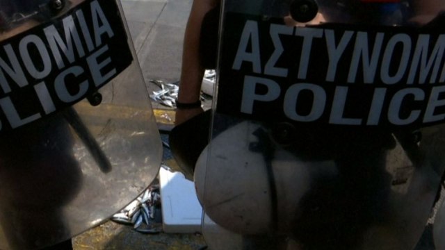 Protesters dump raw sardines outside Greek parliament in protest against fishy austerity measures