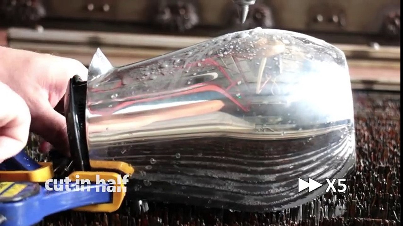 Stainless steel coffee press cut in half with waterjet