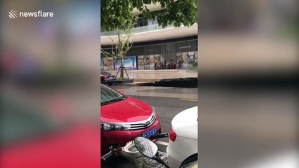 Huge sinkhole swallows minivan in southern China
