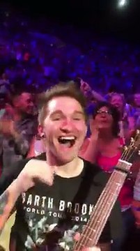 Garth Brooks Gives His Guitar to Deserving Fan During Concert