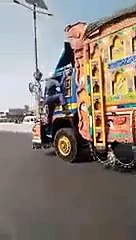Pakistani Traffic Warden RISKS his LIFE to stop a fast moving truck