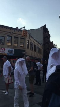 People Wearing White Outfits and Veils Make Their Way to Stonewall Inn For Pulse Vigil