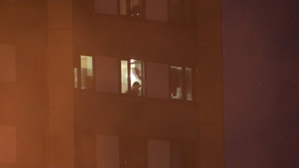 Residents seen desperately waving for help from Grenfell Tower fire