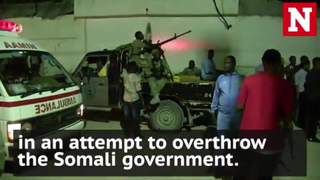 Hostage situation in Somali capital after car bombing leaves at least 12 dead